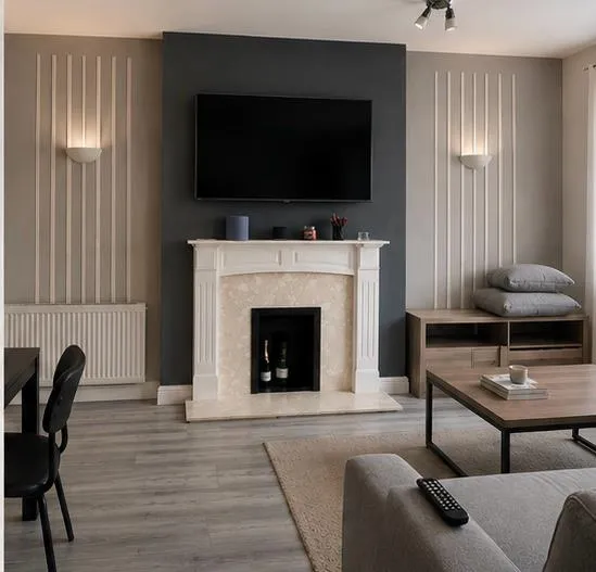 Finished living room with a dark fireplace panel and vertical painted feature details